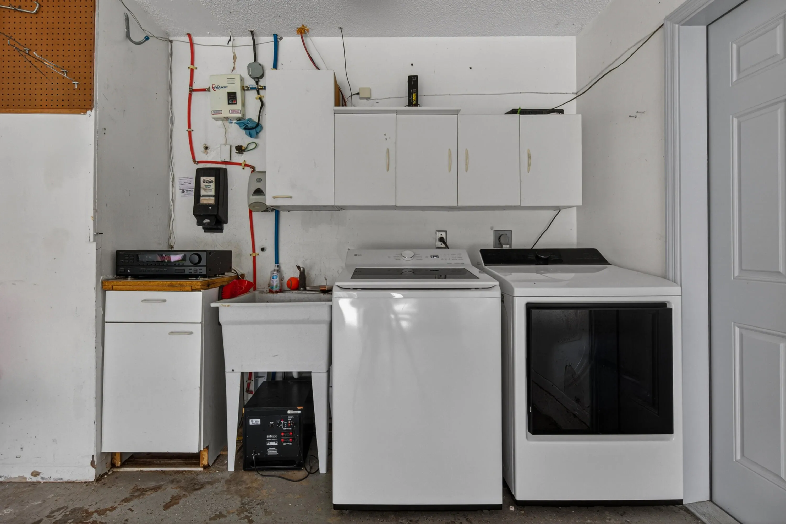 Washer/dryer and laundry sink in garage