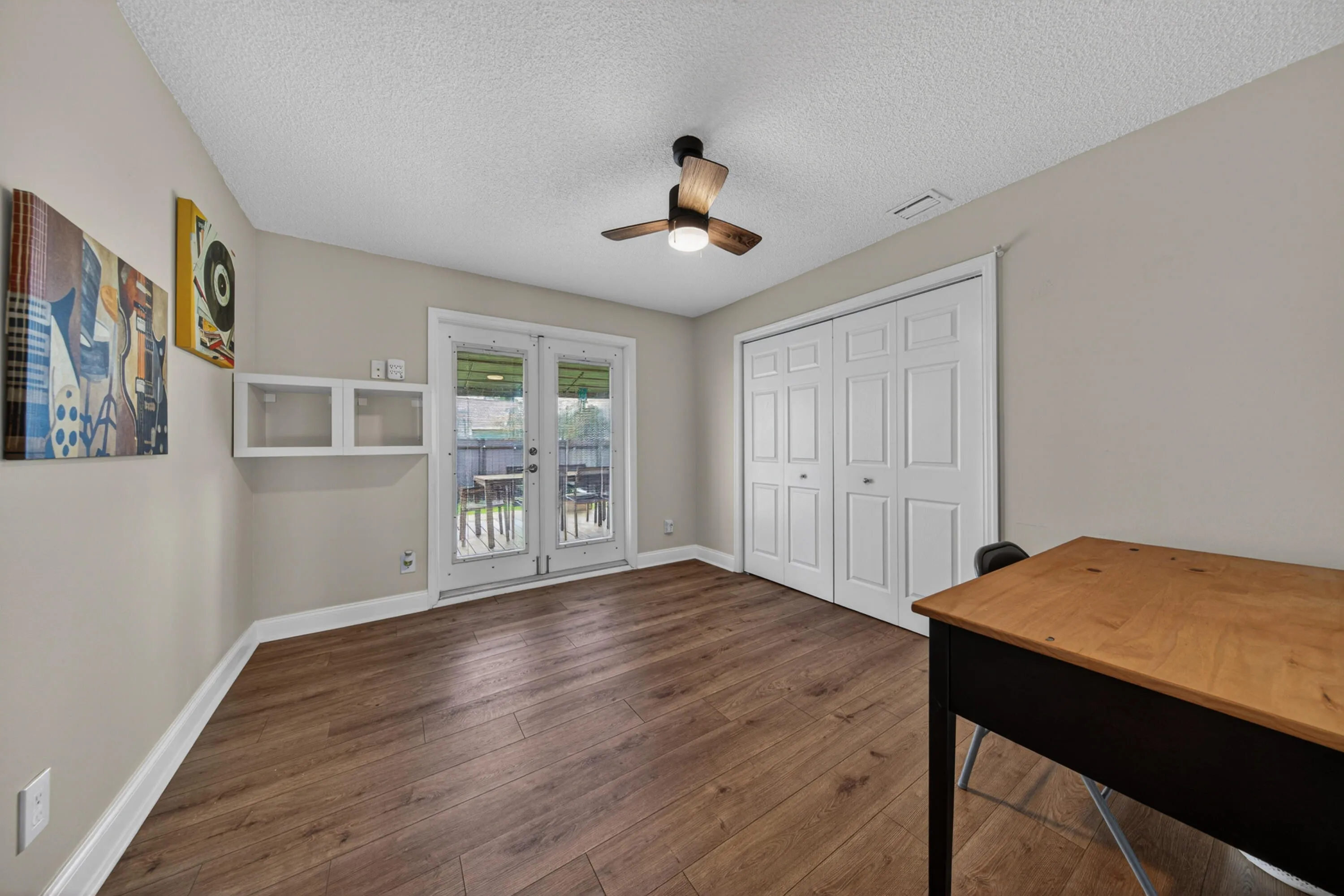 large secondary bedroom with access to backyard
