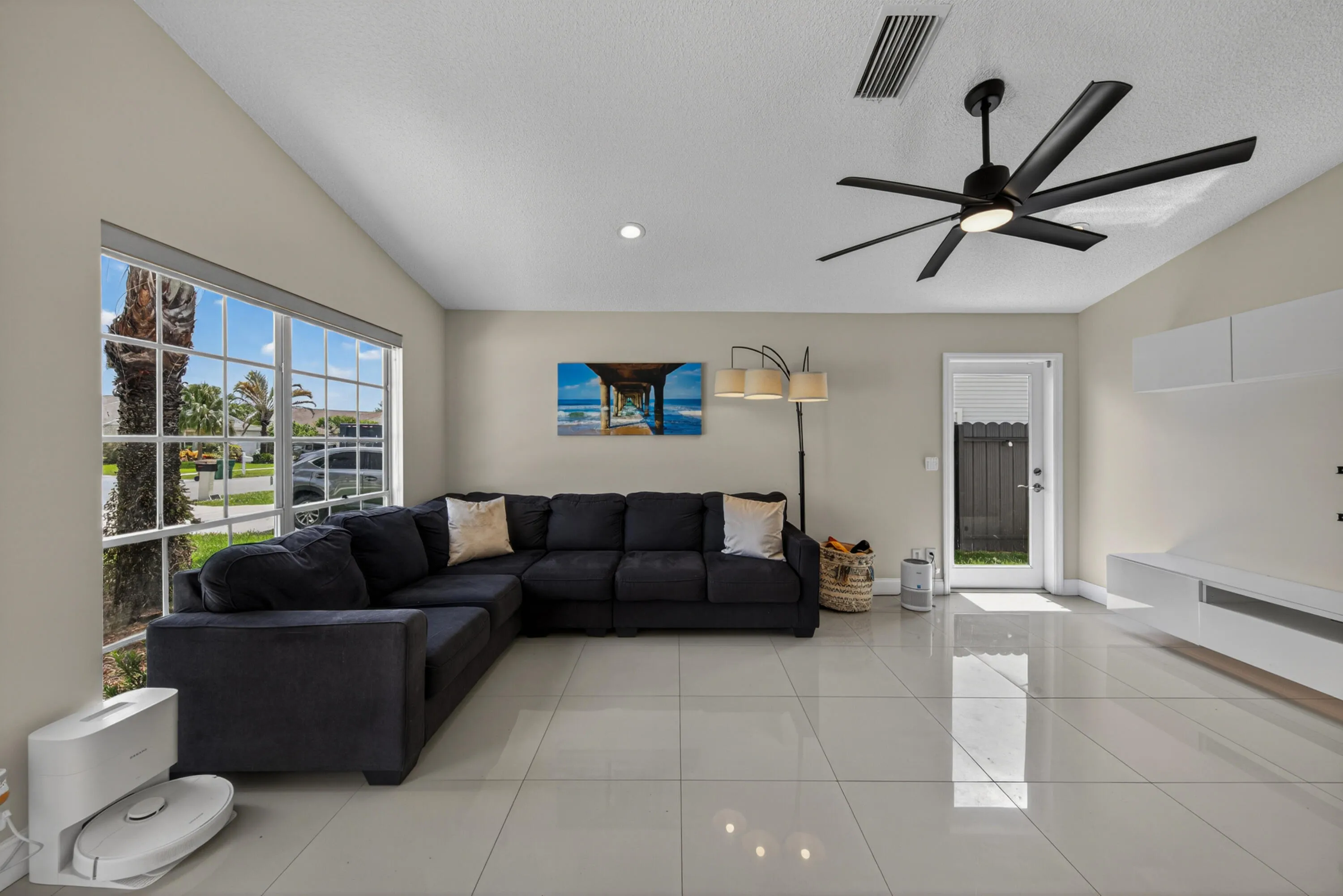 bright, open floor plan with lots of windows and doors