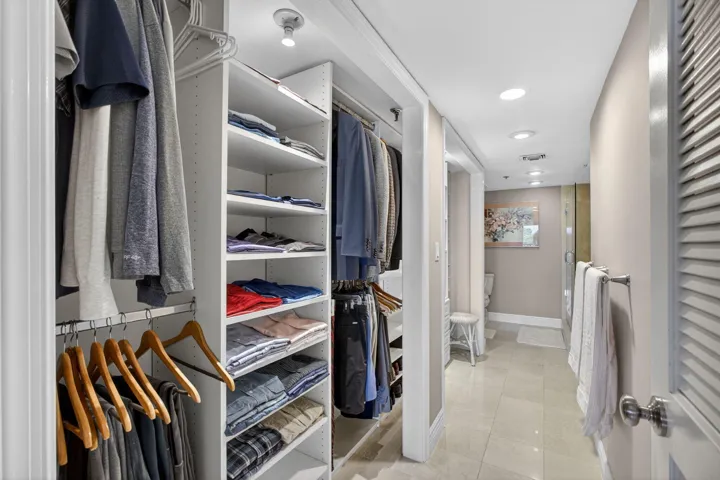 Primary Closet into Bathroom