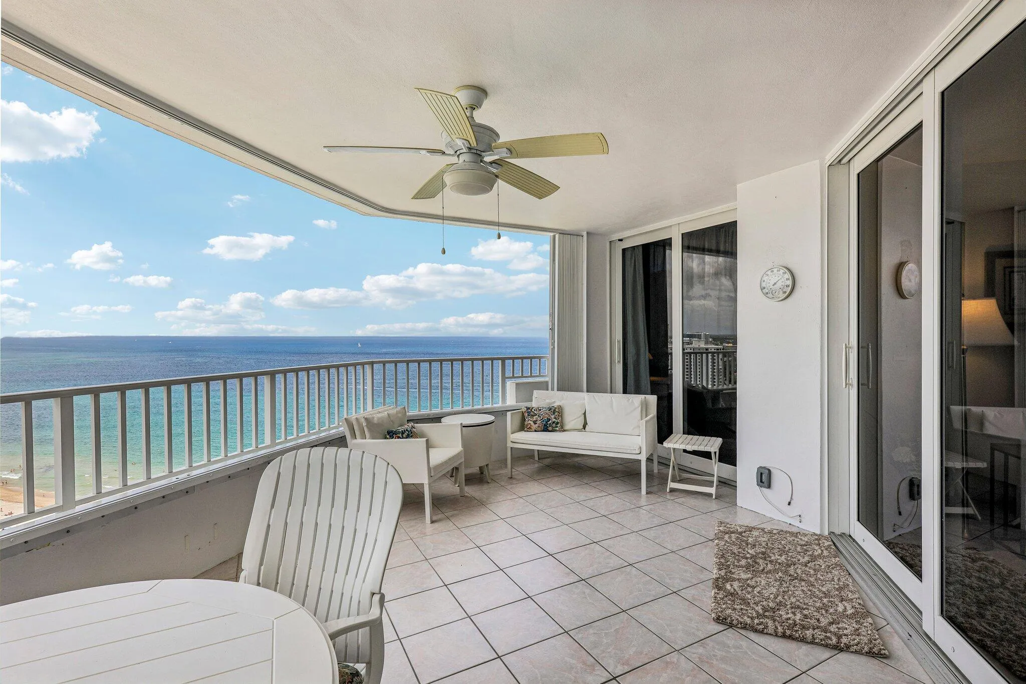 Large terrace with space for plenty of chairs and a dining table.
