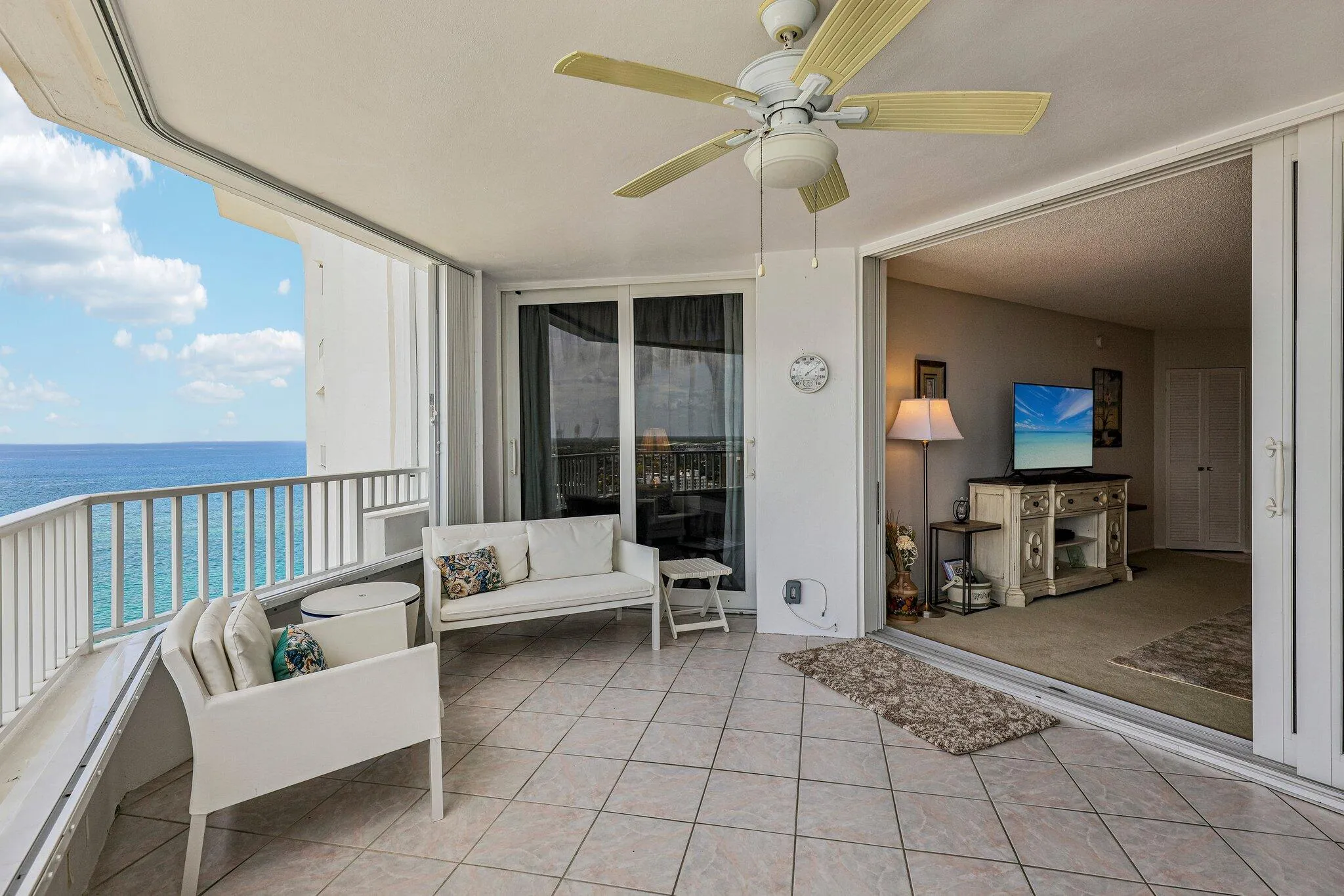 Large terrace with space for plenty of chairs and a dining table.