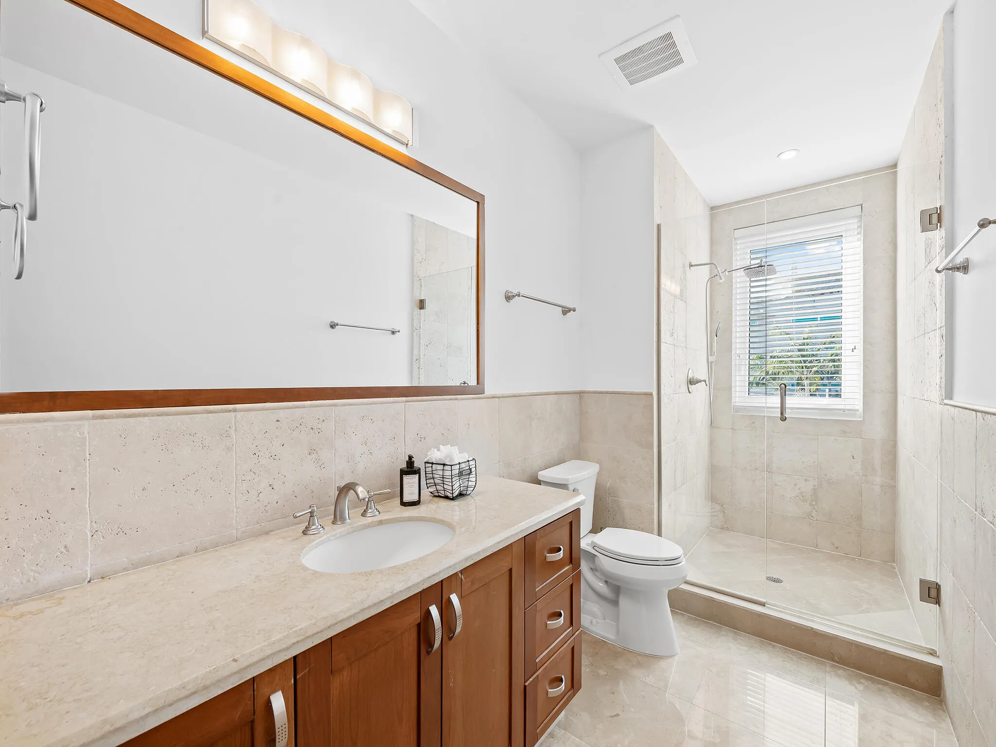 Guest bathroom with generous storage space.