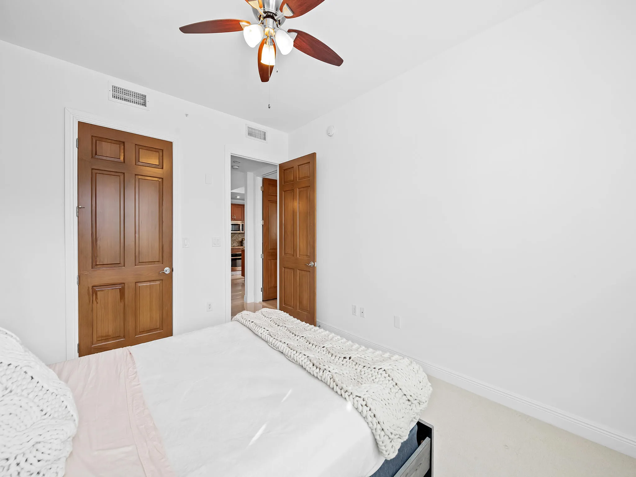 Guest bedroom with a walk-in closet.