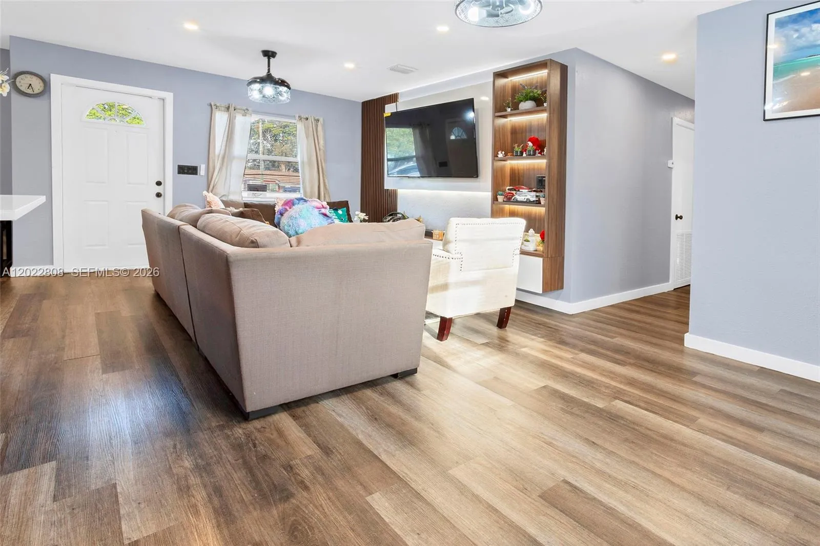 Spacious family living area with modern finishes, abundant natural light, and an open-concept design.