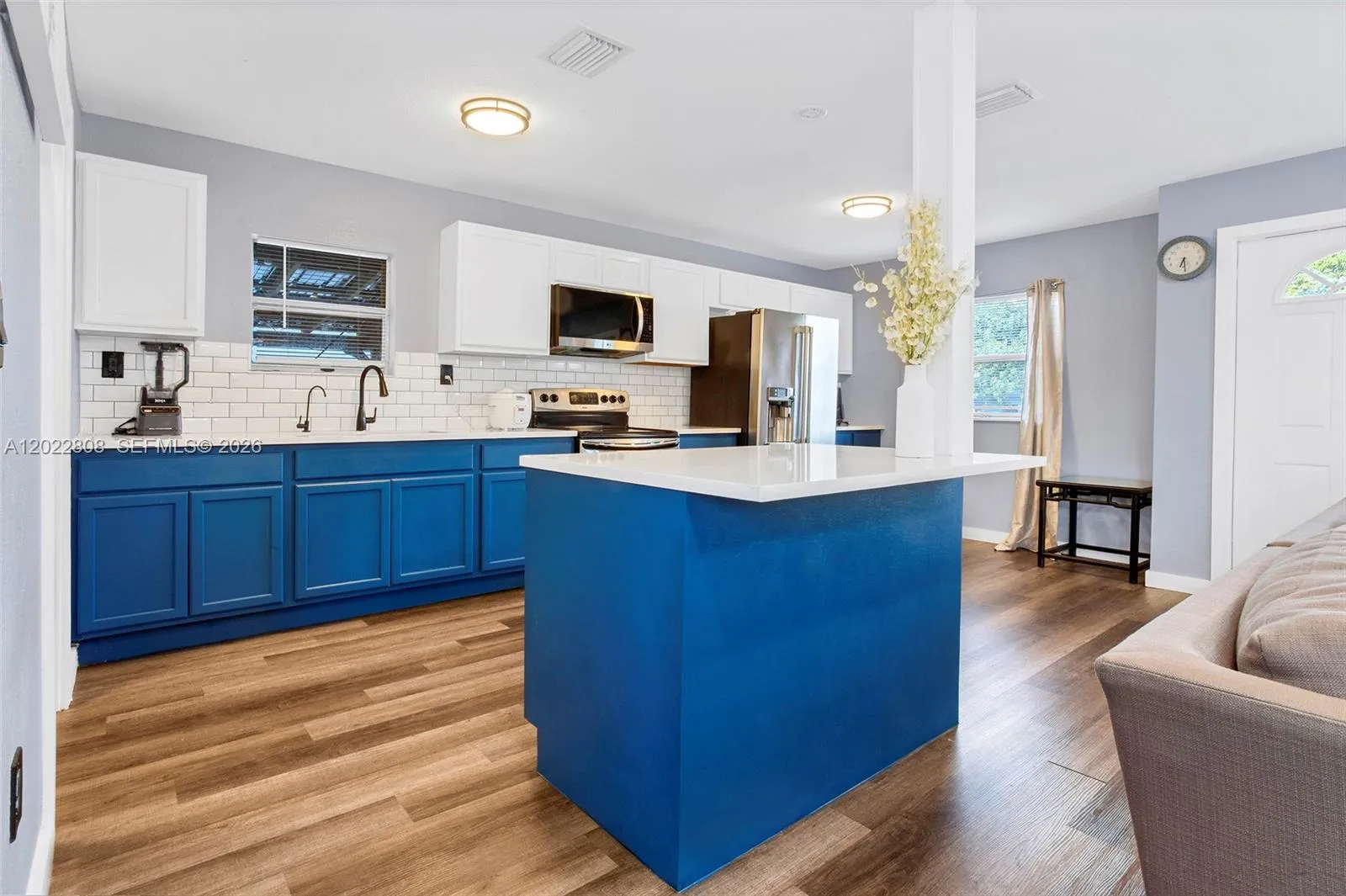 Updated kitchen with stainless steel appliances, modern finishes.