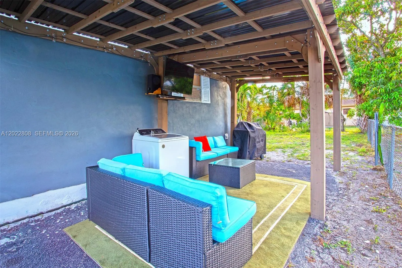A cozy covered retreat designed for weekend barbecues, evening gatherings, and making lasting memories.