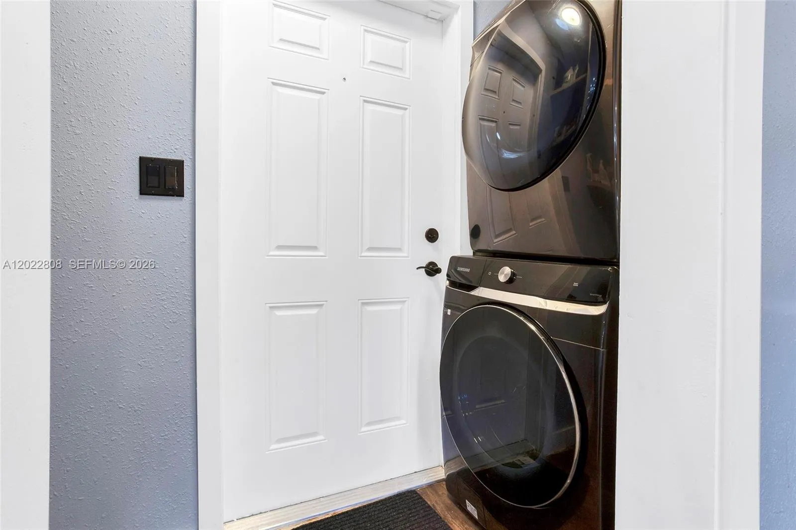 New full size washer and dryer, laundry area offering convenience and extra storage.