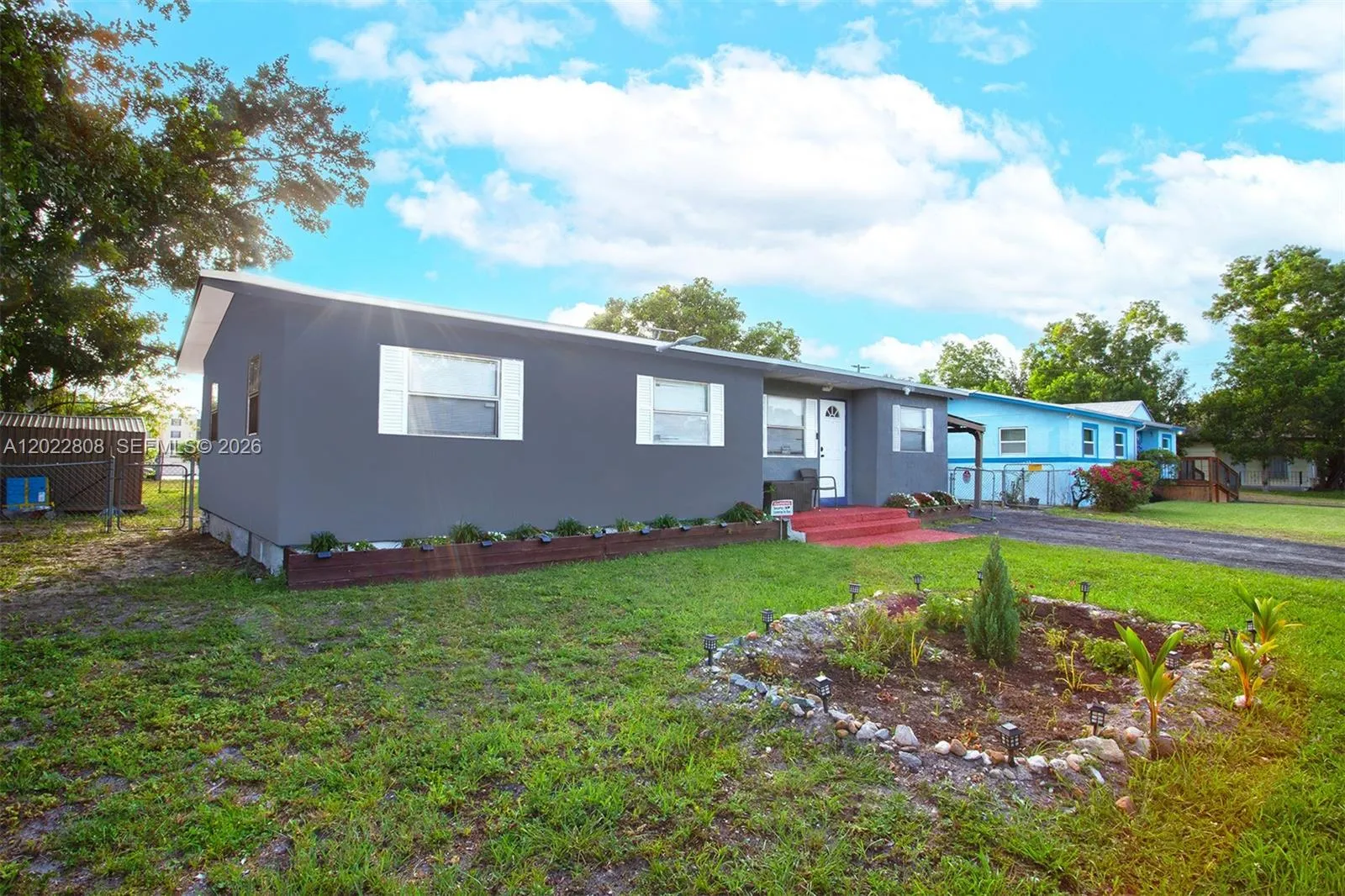 Charming curb appeal with a spacious yard, ample parking.