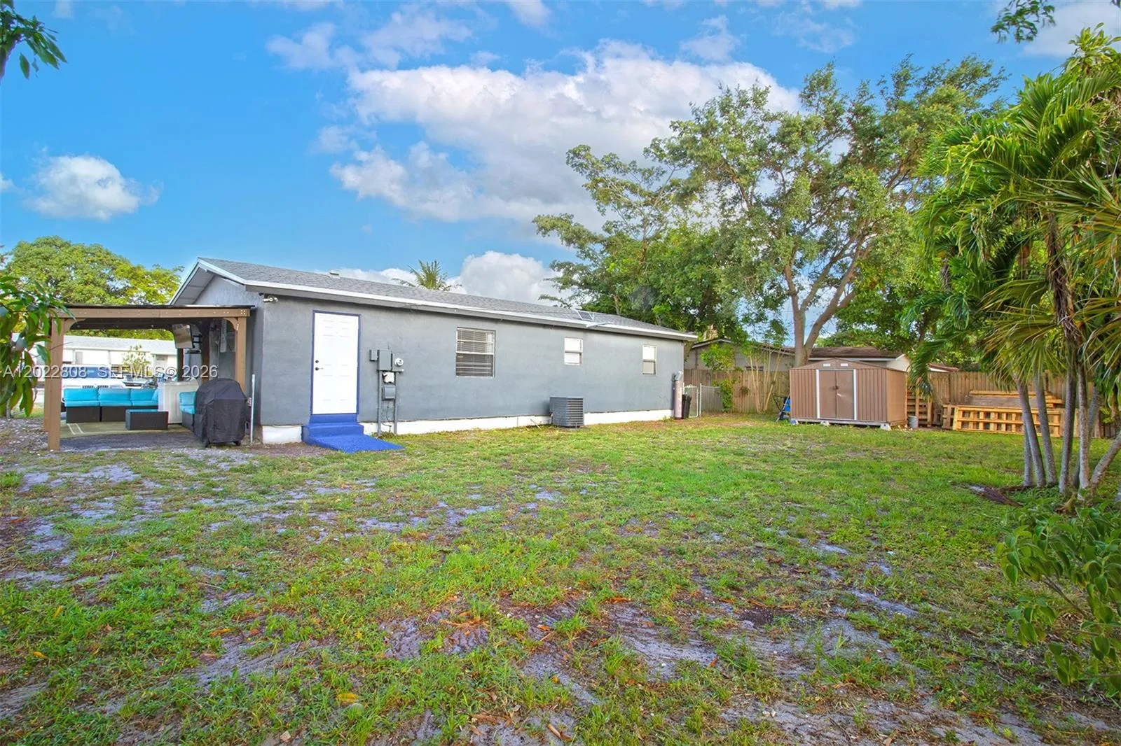 Expansive outdoor space with mature trees and endless possibilities for recreation, gardening, or future enhancements.