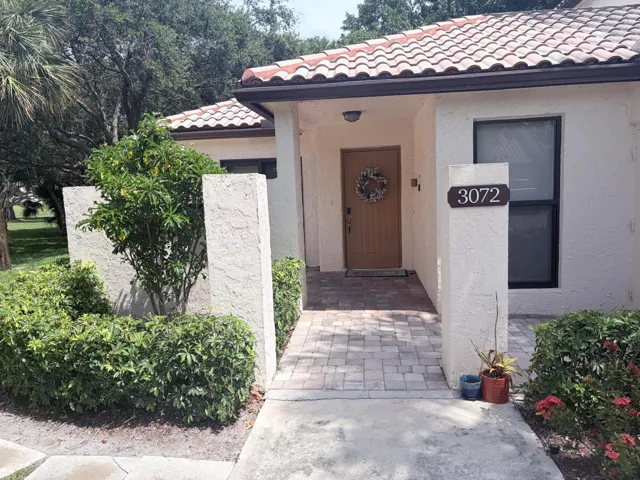 Private front entry with patio