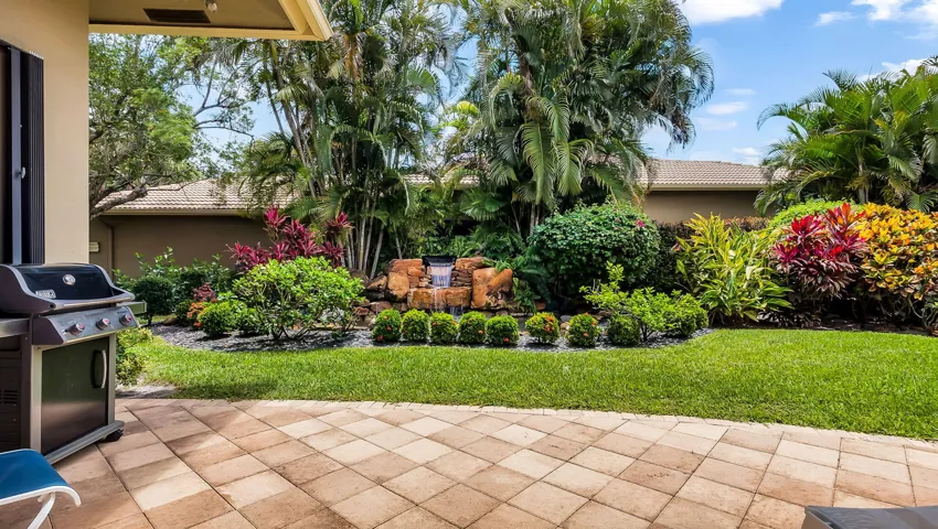 Tropical Oasis with Pond and Fountain