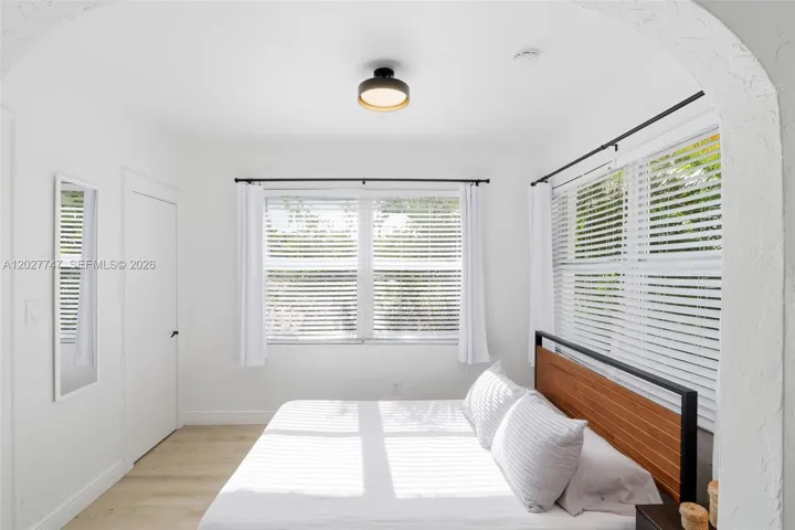 Spacious, light-filled bedroom area in the apartment.