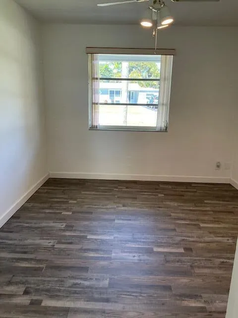 Den with Luxury Vinyl Plank Flooring is located off the Kitchen with a Separate entry to Garage.