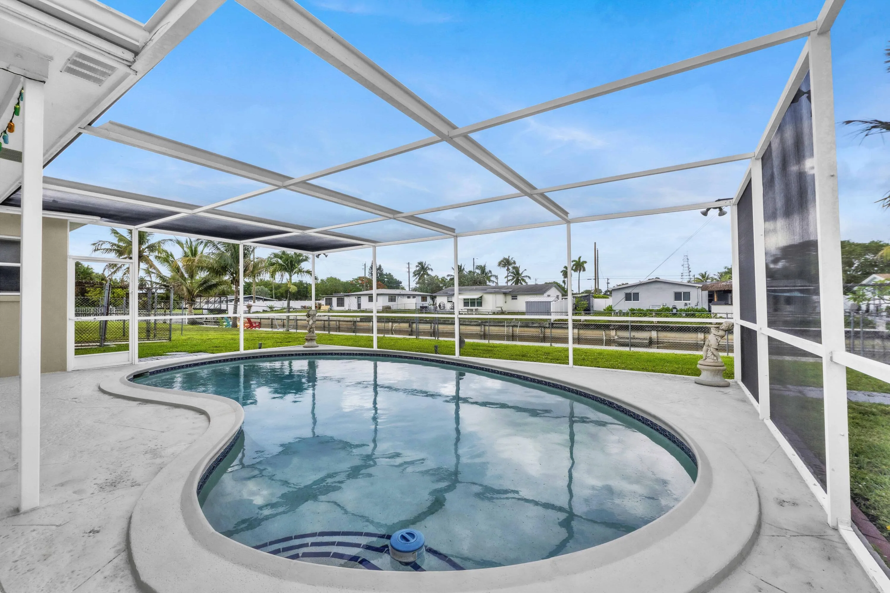 Screened Freeform Pool with Spacious Yard