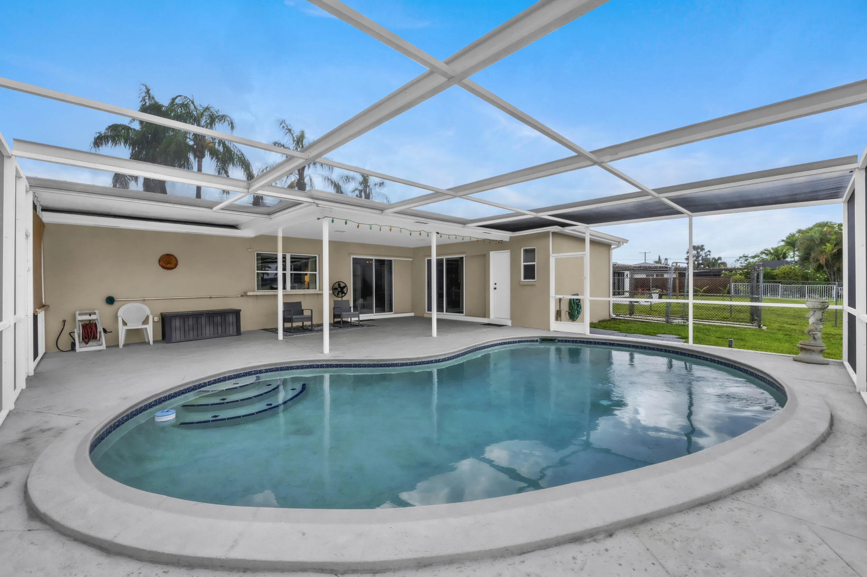 Pool View & Back of Home with Pocket Sliders opening for Outdoor Living