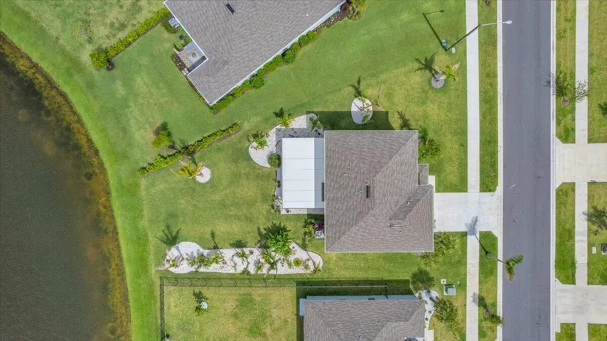 Lakefront corner lot with added trees and landscaping