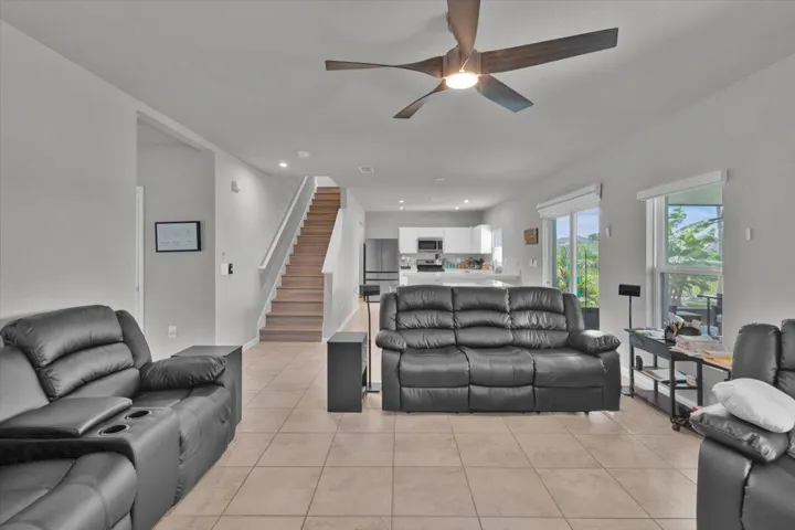 Spacious area open to the kitchen and staircase