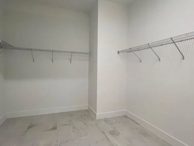 EXPANSIVE PRIMARY CLOSET - SIZE OF GUEST BEDROOM