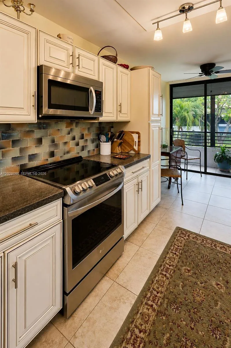 The kitchen boasts updated appliances and so much storage!