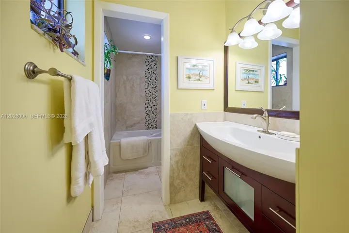 Second bathroom features a spa tub