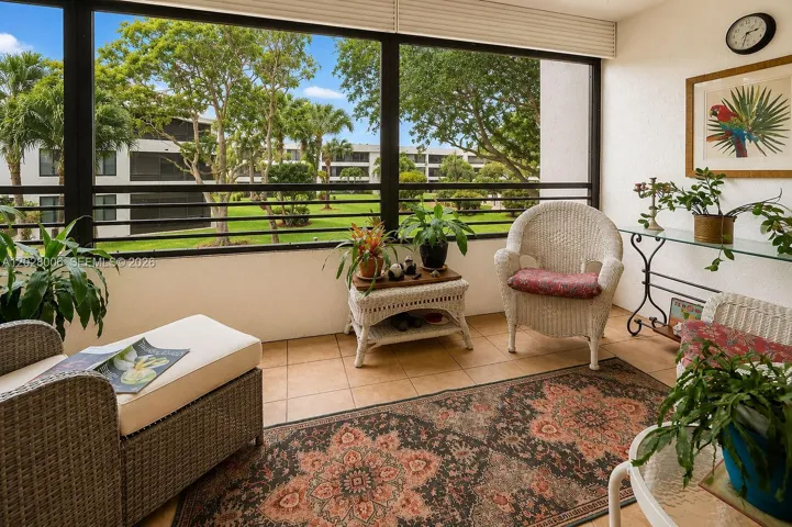 The screened in lanai offers beautiful views over the peaceful landscaped gardens from the 2nd floor