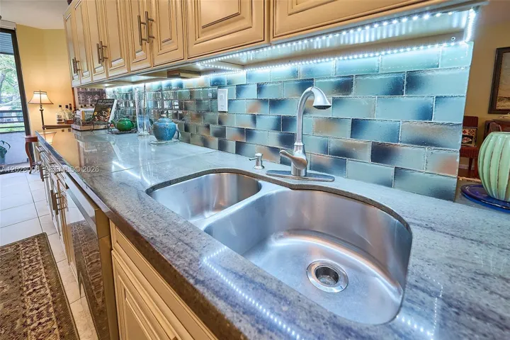 Tile splashbacks, under cabinet lighting, and granite counters