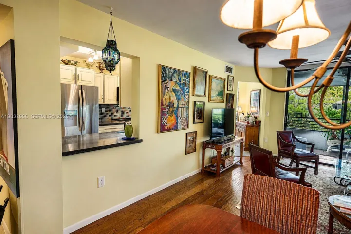 There is a pass through from the kitchen to the dining area