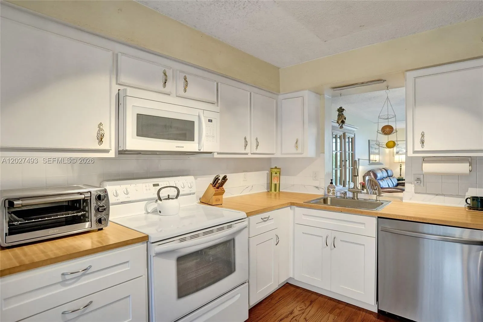 Butcher Block Counters Accent the White Kitchen!