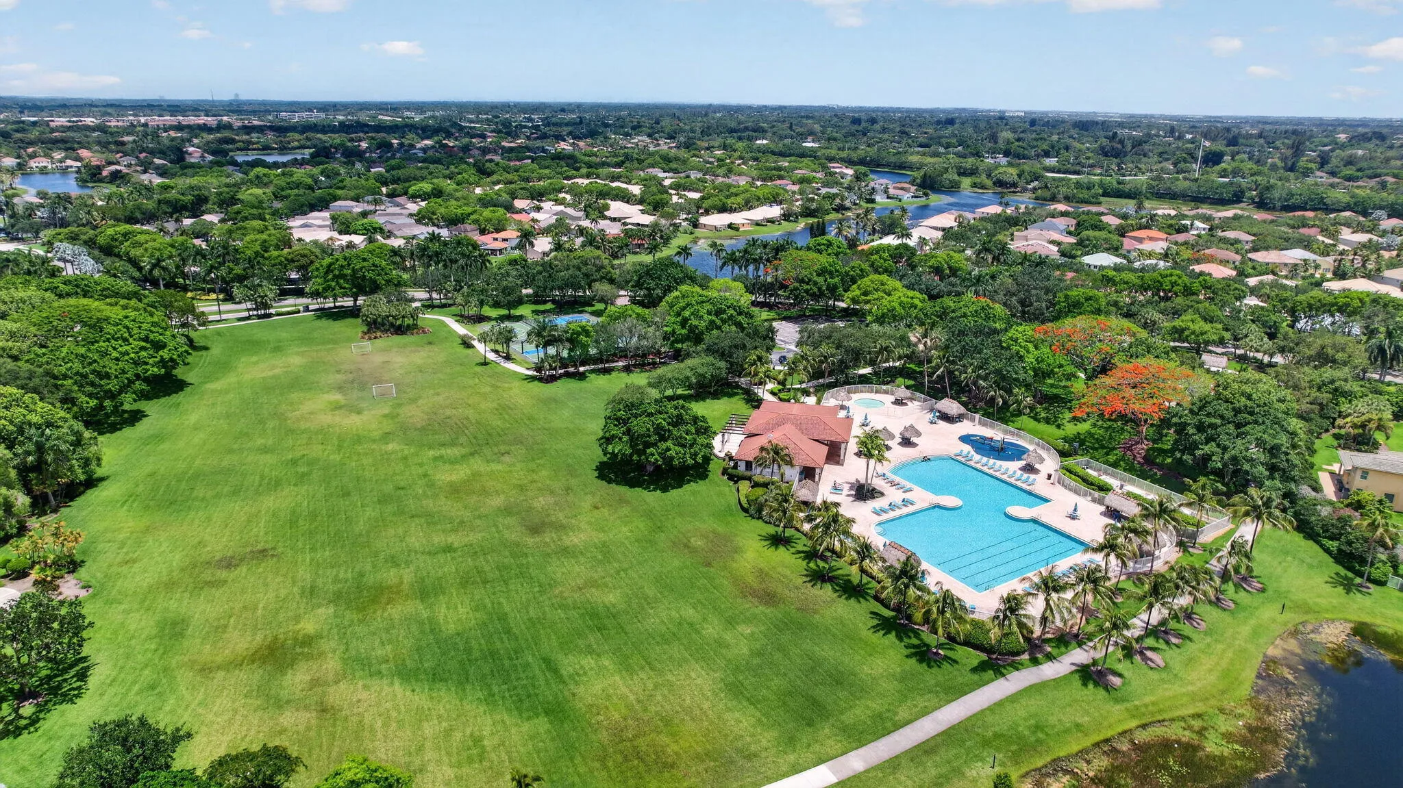 Aerial of The Ridges community clubhouse with pool and park