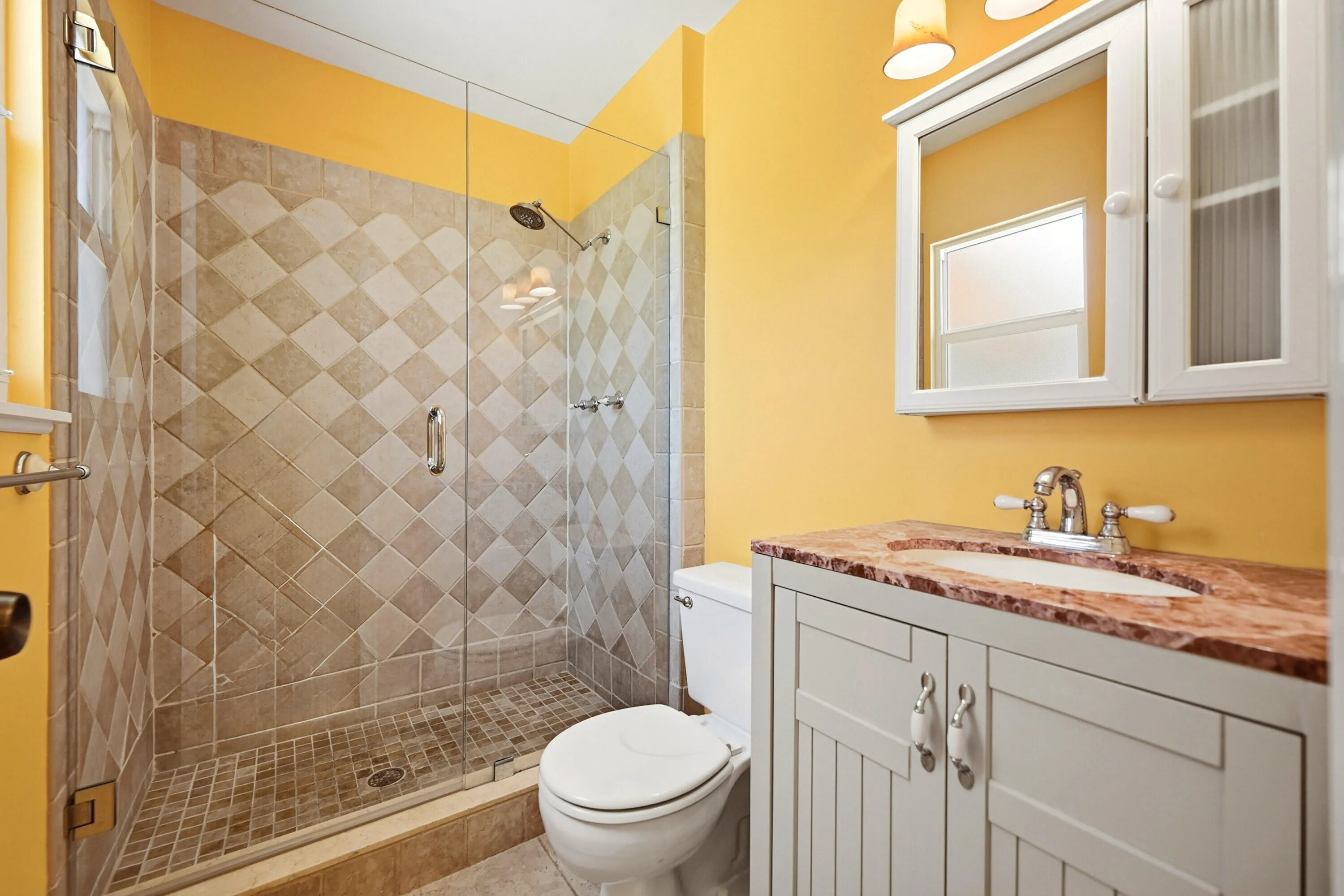 Updated Master Suite with new vanity, faucets, stone counter and Step in Frameless Shower with Custom Tile Design