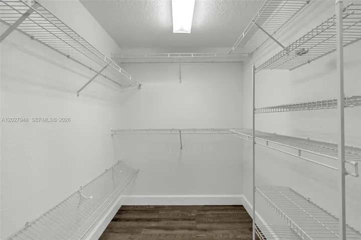 ONE OF TWO PRIMARY CLOSETS