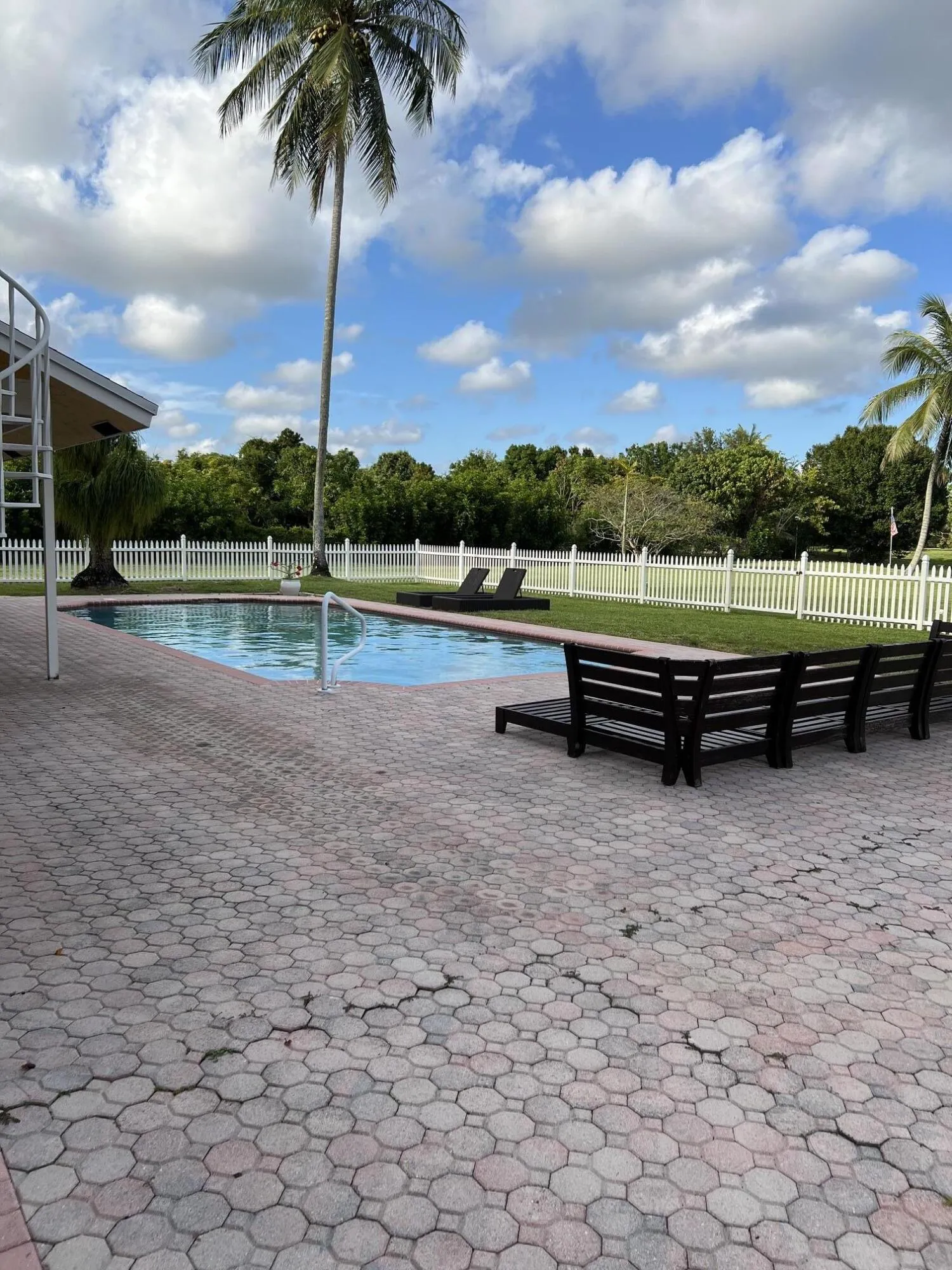 Pool with paved deck and lots of privacy