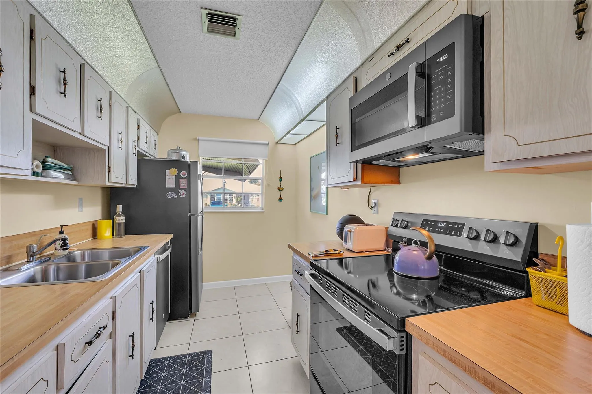 gally kitchen with newer appliances