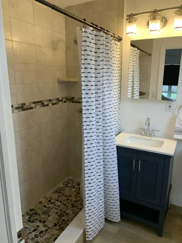 Clean and bright En-suite with large walk-in shower