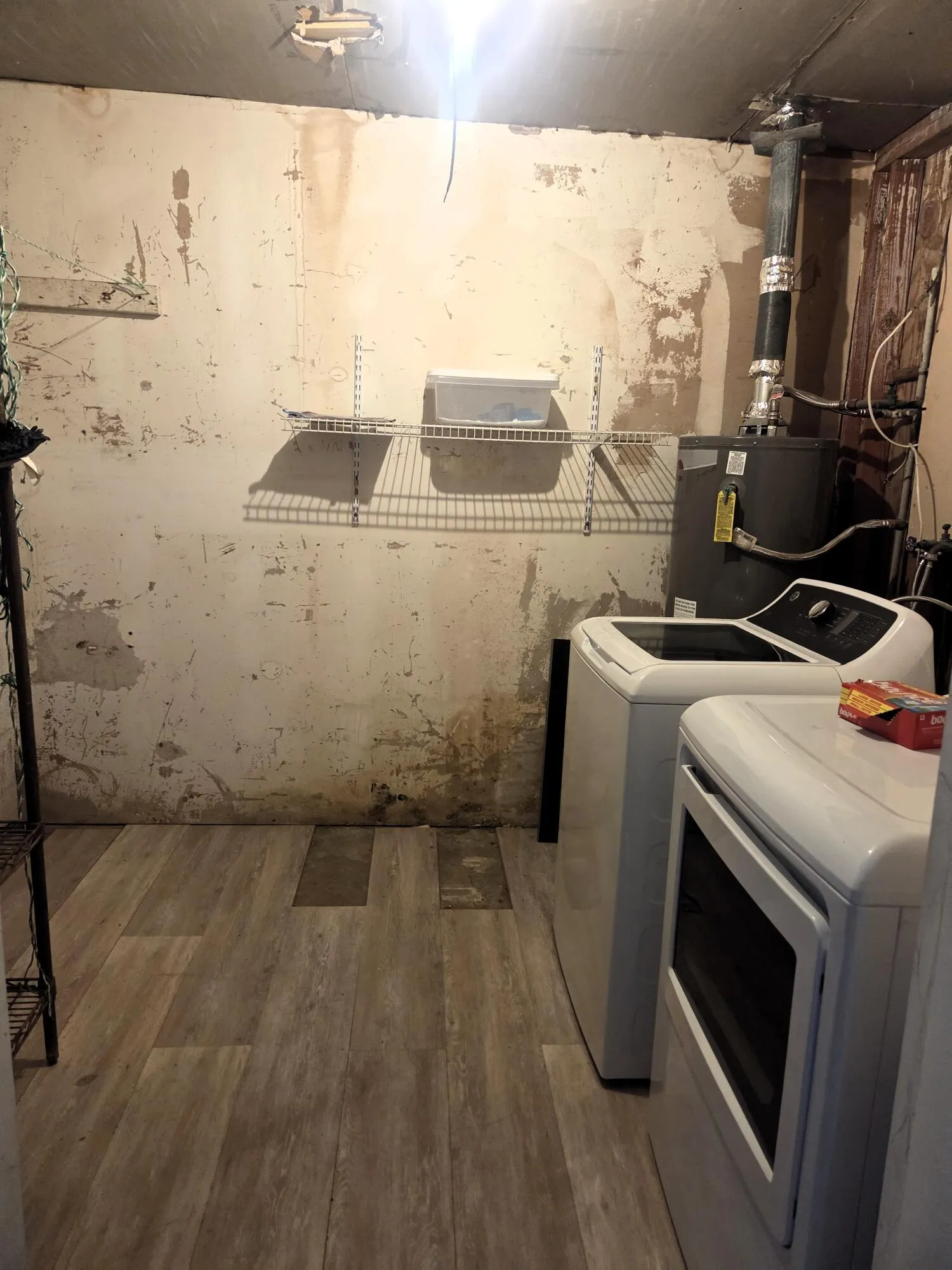 in unit laundry w vinyl plank floors.