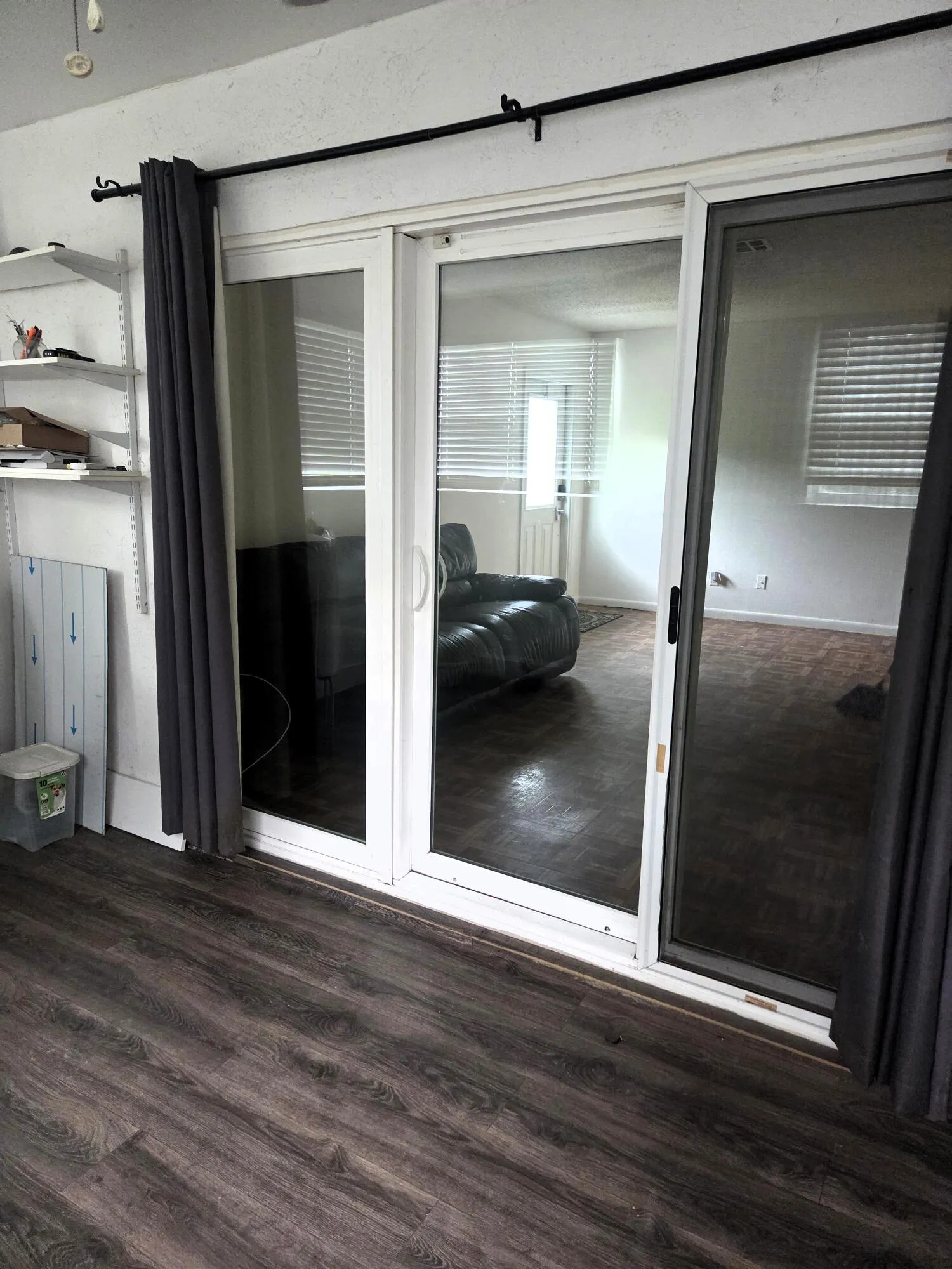 impact sliders to encl patio area w vinyl pank floors (2 windows and door in encl patio are NOT impact)