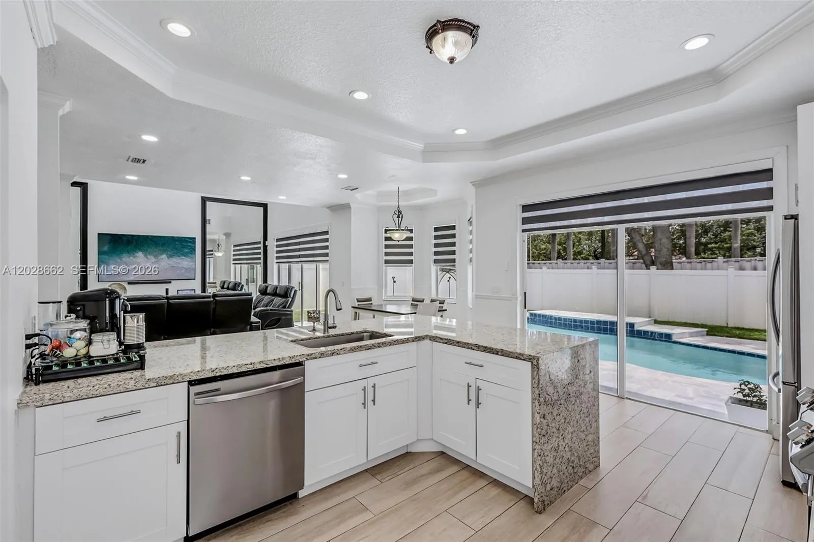 Kitchen island with view of pool