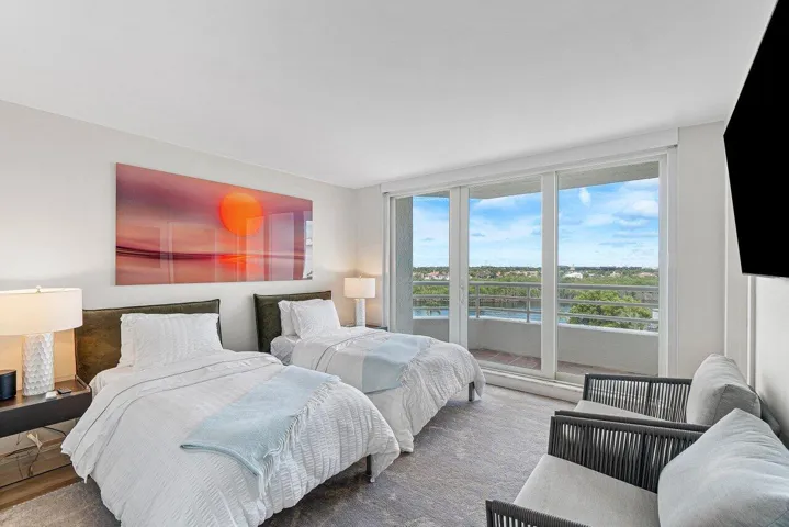 THE GUEST BEDROOM HAS A WALK IN CLOSET, PRIVATE BATHROOM & BALCONY!