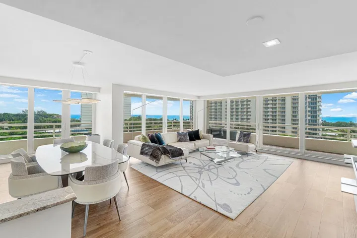 THE LIVING ROOM & DINING ROOM ARE SURROUNED BY FLOOR TO CEILING WALLS OF IMPACT GLASS!