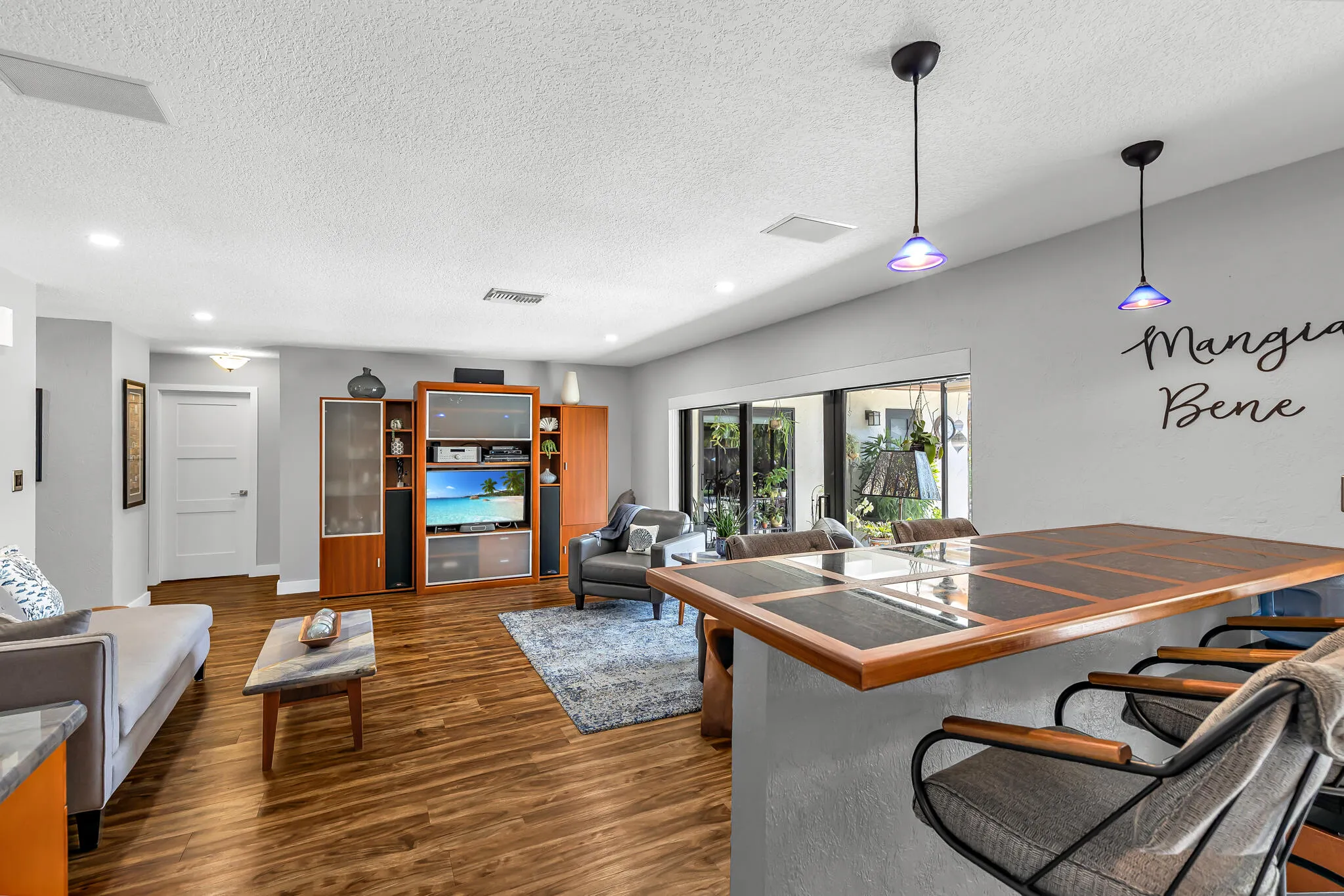 Family Room from the Kitchen with Modern Center Bar