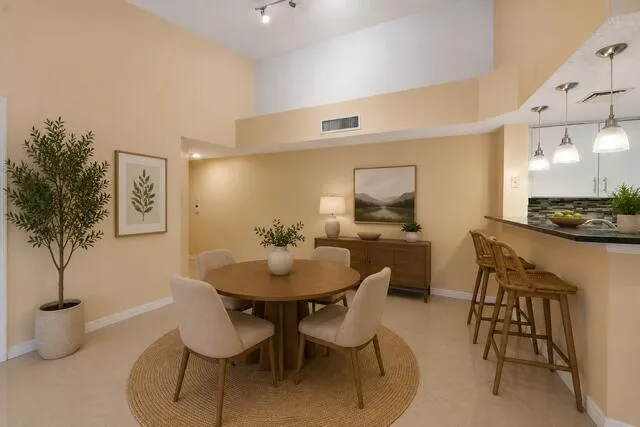 Virtually Staged Dinning Room with Kitchen Bar
