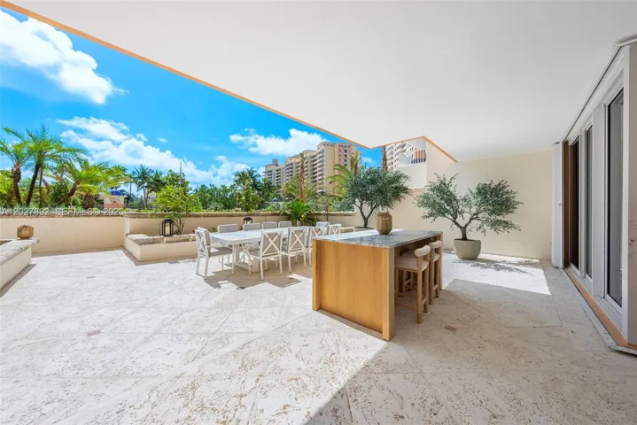 Main terrace with direct access to the pool deck & beach