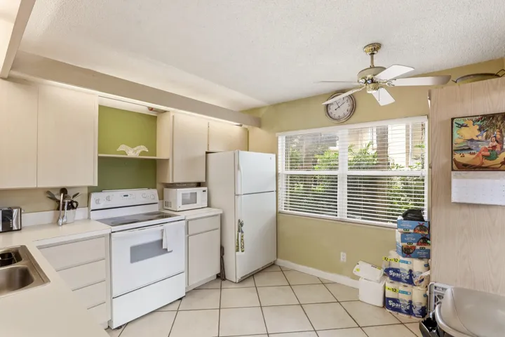 Abundant natural light fills the kitchen, creating a cheerful and welcoming space for everyday living.