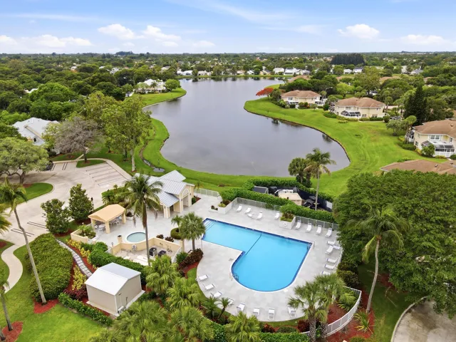 The community pool overlooks a beautiful lake, creating a relaxing setting to soak up the Florida sunshine.