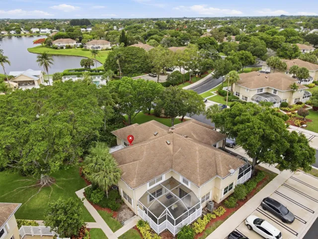 This townhome enjoys a private, park-like setting with lush green space and the community pool just steps away.