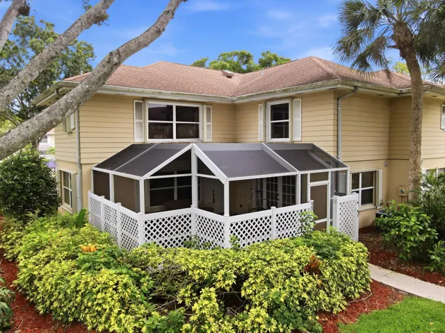 Beautiful two-story townhome with a screened patio, mature landscaping, and a prime location within the community.