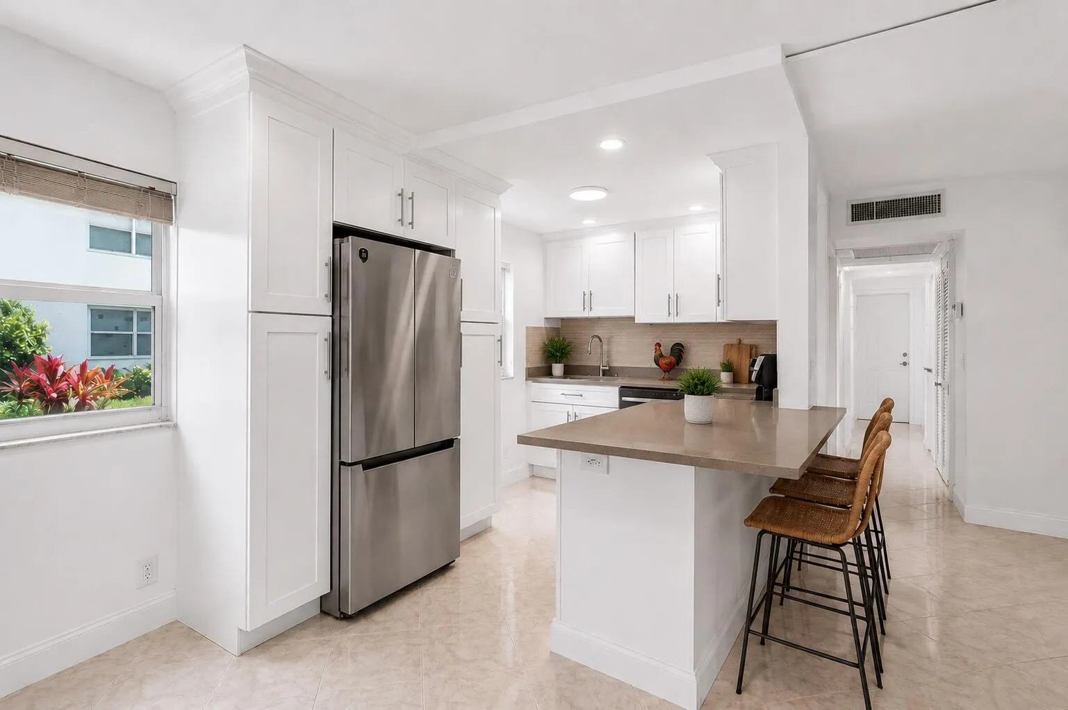 Kitchen and bar area virtually staged