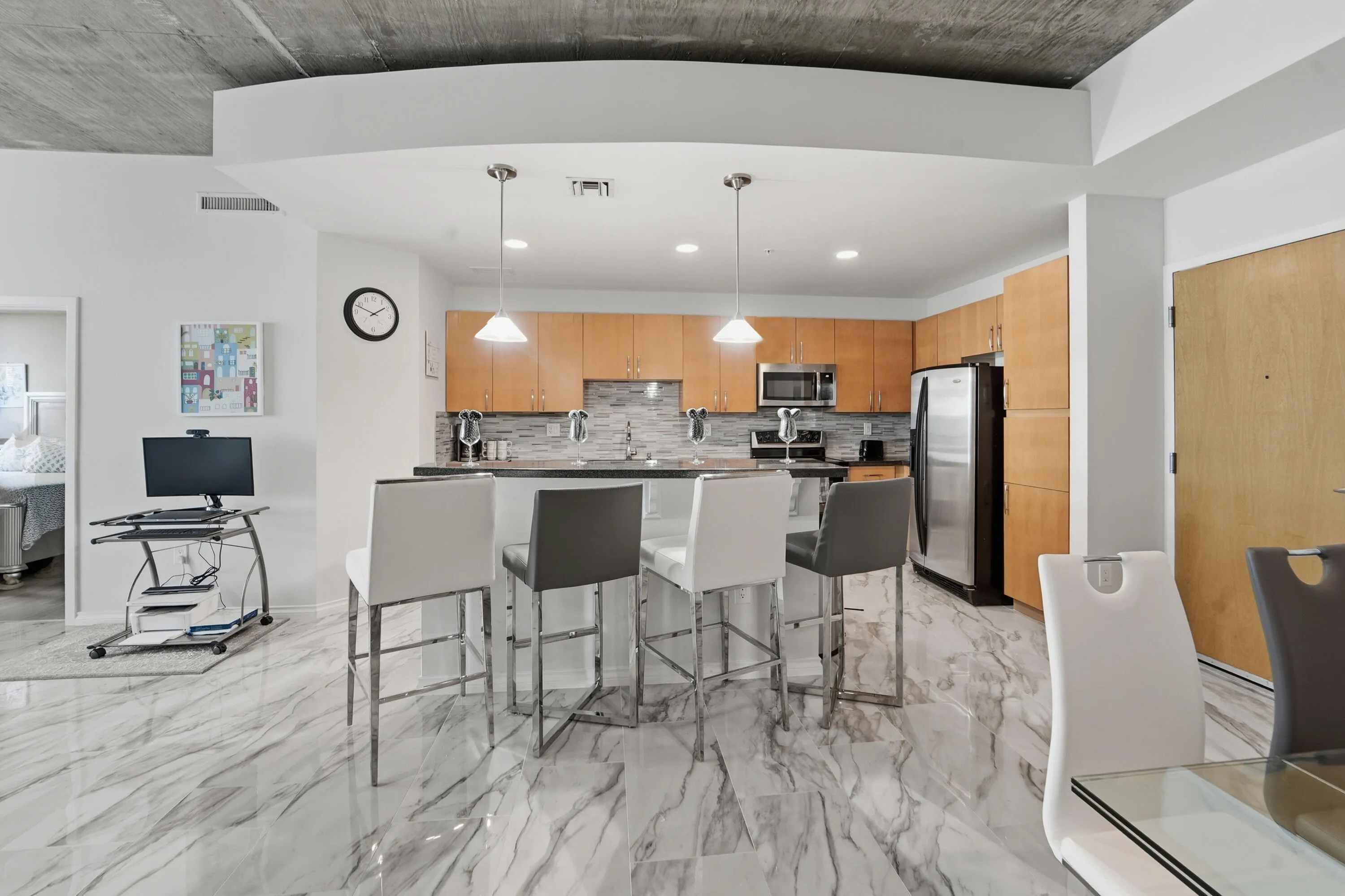 Fully outfitted kitchen with island and 4 leather bar stools. Great for entertaining!