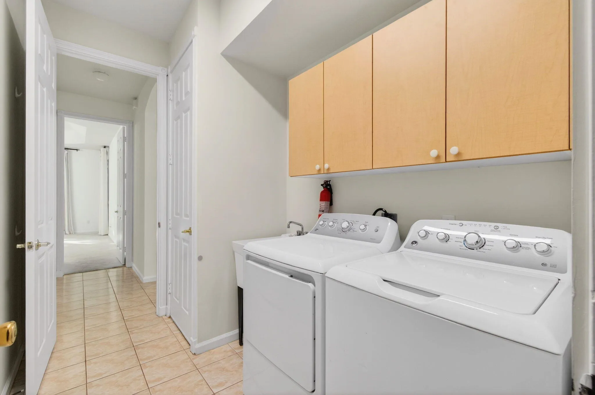 Laundry Room has storage cabinets